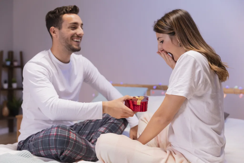 A man giving gift to a woman