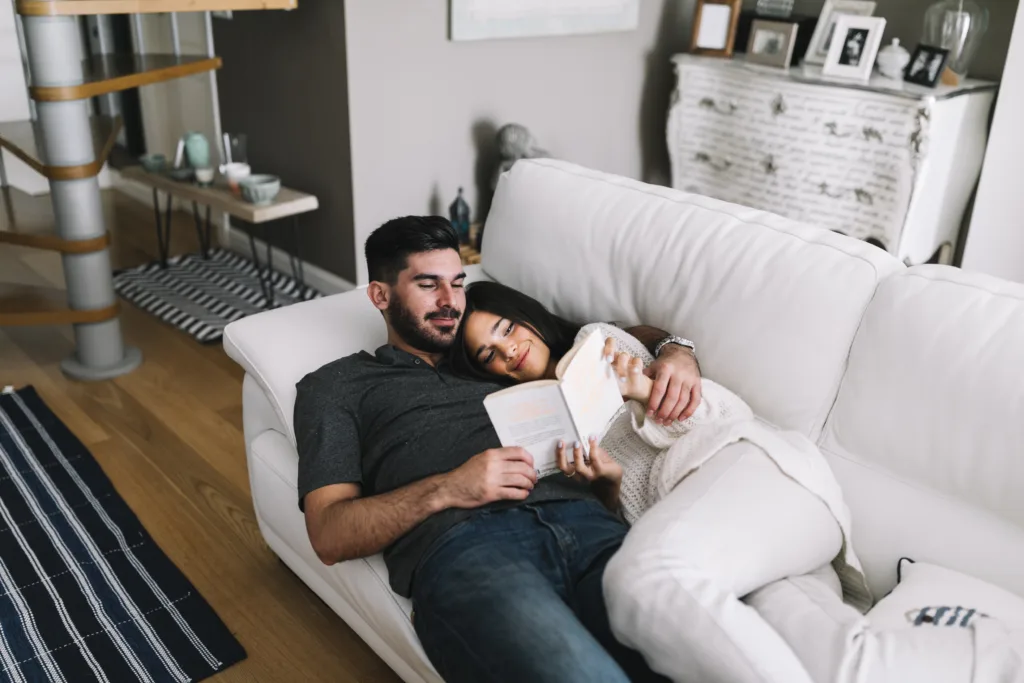 Young couple lying on sofa