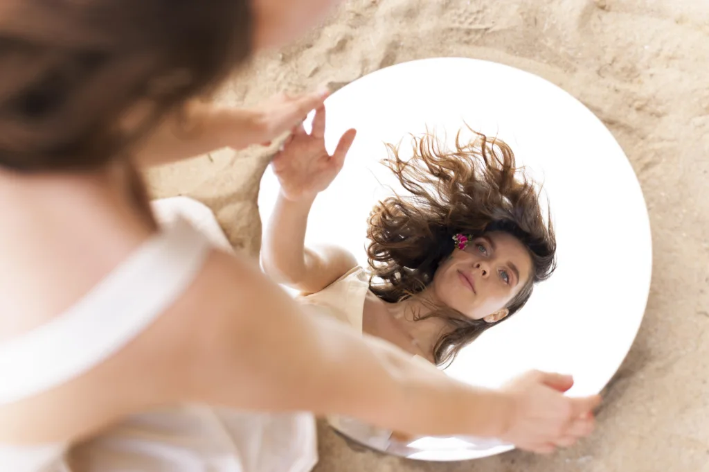 A woman looking into a mirror